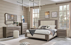 Modern bedroom with wooden furniture, including a bed, dressers, and nightstands.